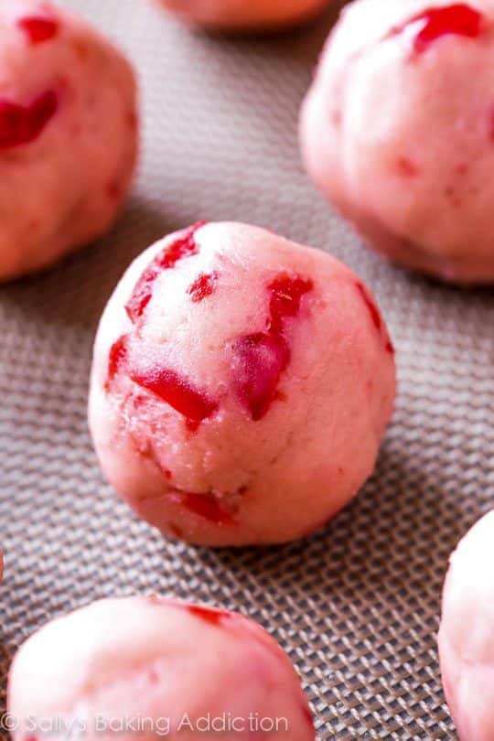 chocolate cherry blossom cookie dough balls on a silpat baking mat