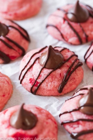 chocolate cherry blossom cookies topped with a Hershey's Kiss and drizzled with chocolate