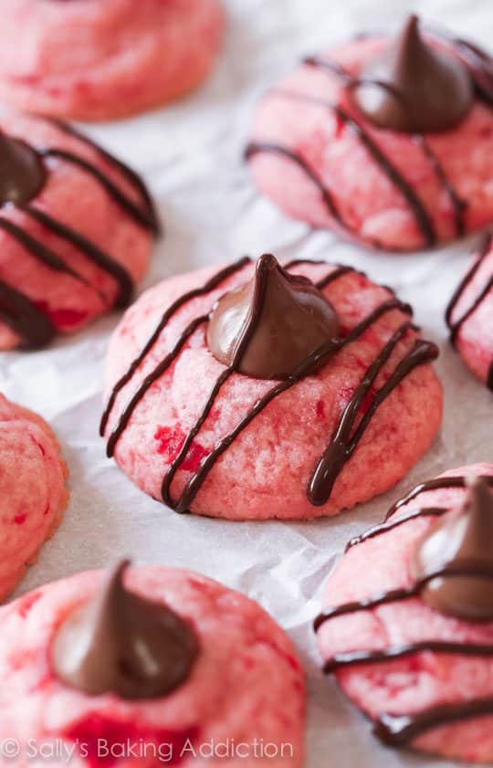 chocolate cherry blossom cookies topped with a Hershey's Kiss and drizzled with chocolate