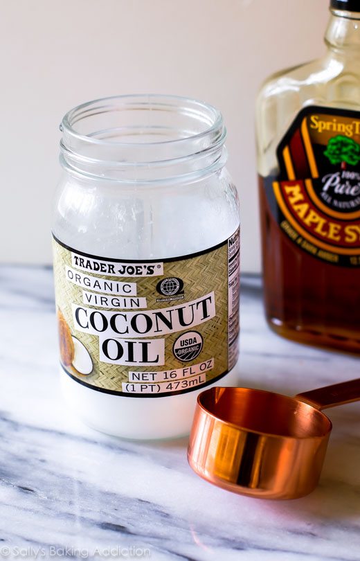 jar of coconut oil and bottle of maple syrup