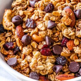 overhead image of trail mix granola in a white bowl