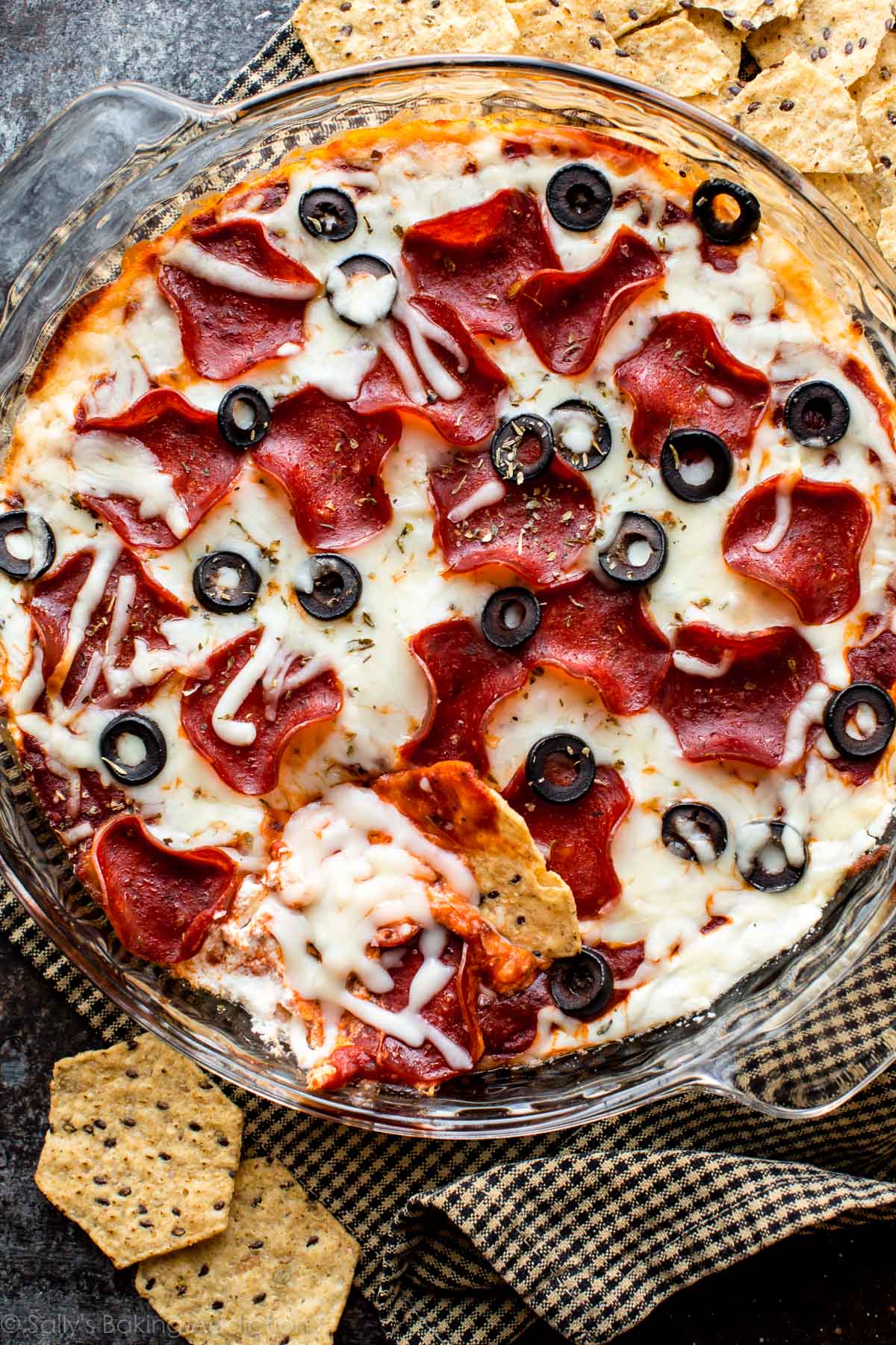 overhead image of pepperoni pizza dip in a glass baking dish