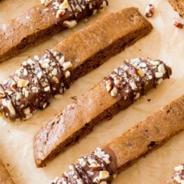 mocha chip biscotti with part of each cookie dipped into chocolate