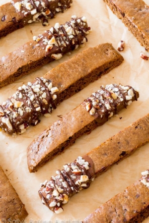 mocha chip biscotti with part of each cookie dipped into chocolate