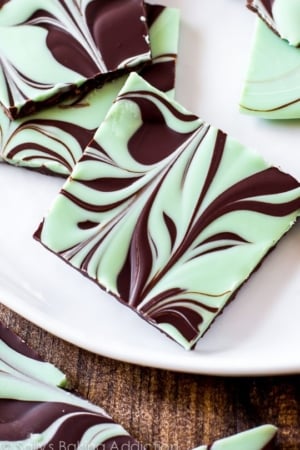 pieces of mint chocolate swirled bark on a white serving tray