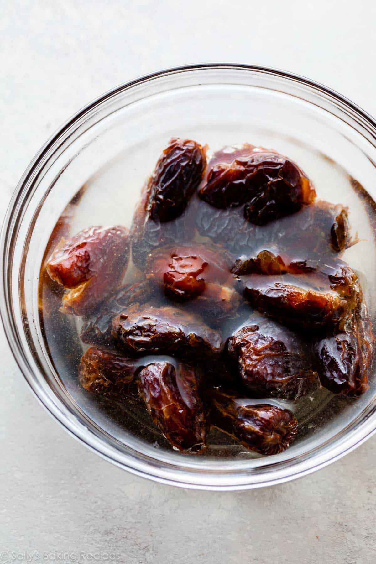 dates soaking in bowl of water.