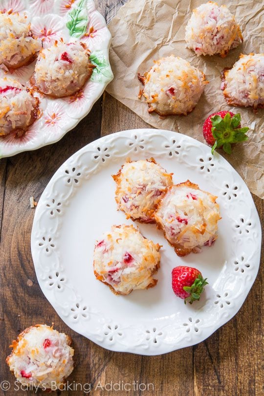 overhead image of strawberry coconut macaroons on a white plate
