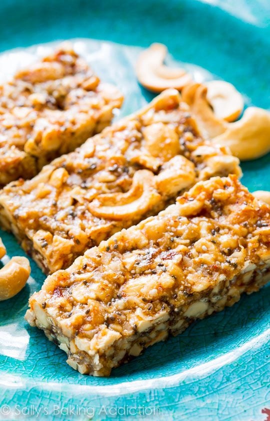 cashew coconut snack bars on a blue plate
