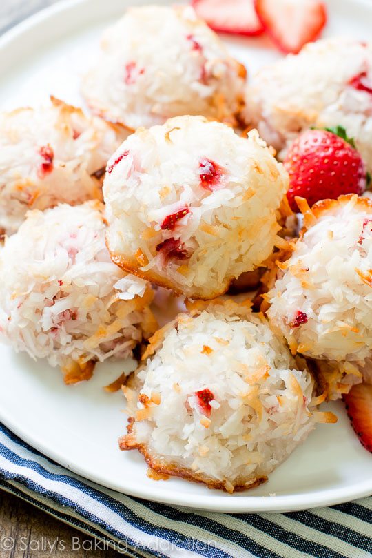 strawberry coconut macaroons on a white plate