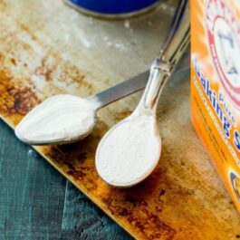 teaspoons of baking powder and baking soda with text overlay that says baking basics a series