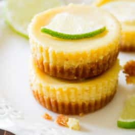 stack of mini key lime pies on a white plate