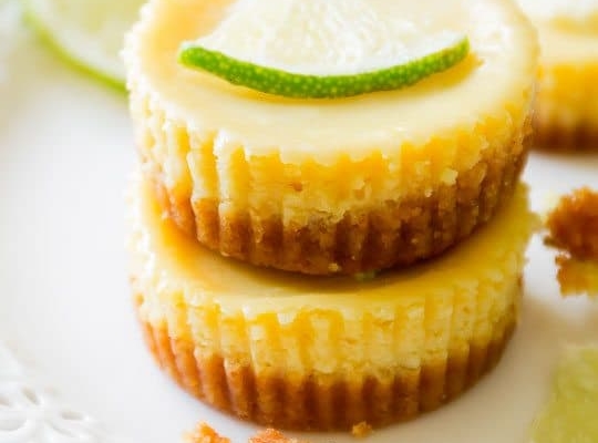 stack of mini key lime pies on a white plate