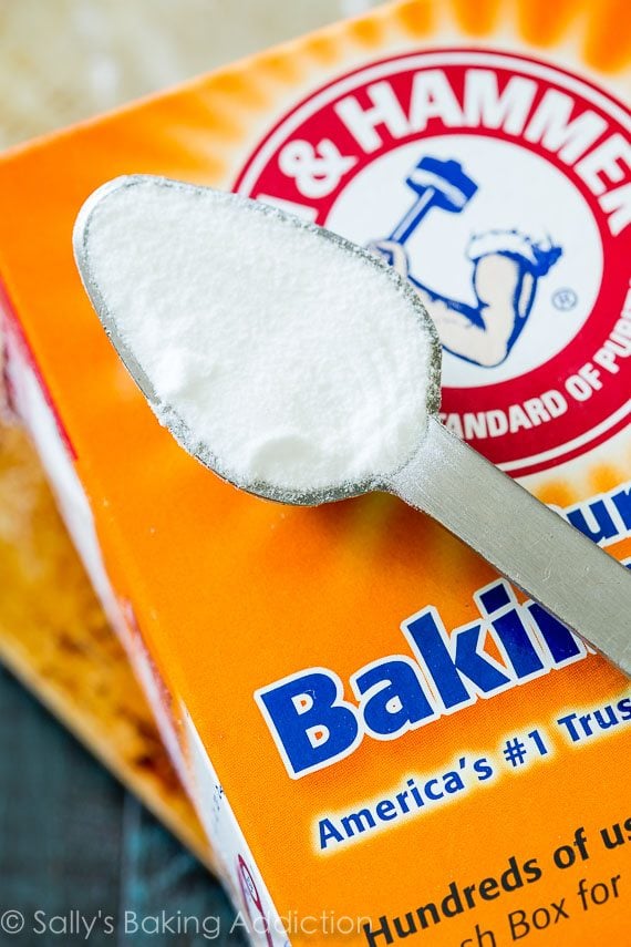 container of baking soda with a teaspoon full