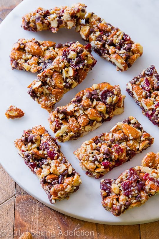 chocolate cherry almond snack bars on a white serving tray