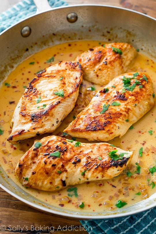 chicken with creamy cilantro lime sauce in a skillet