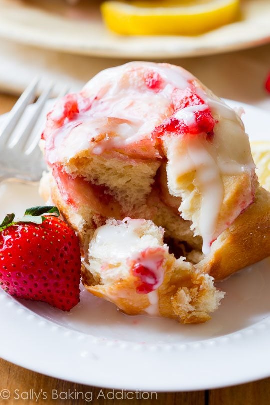 strawberry sweet rolls with lemon glaze on a white plate