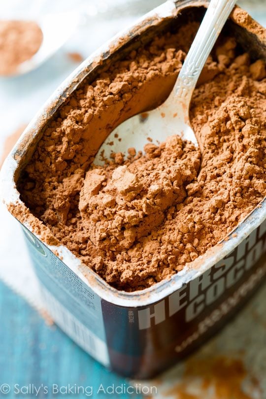 container of cocoa powder with a spoon