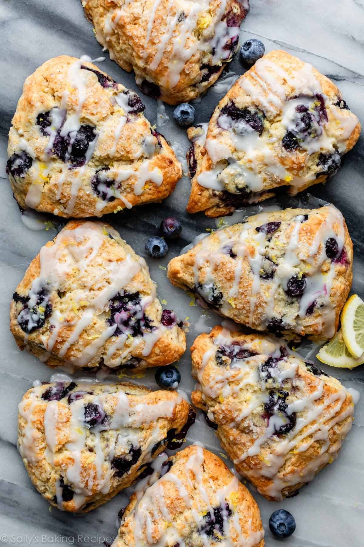 lemon blueberry scones with glaze on top.