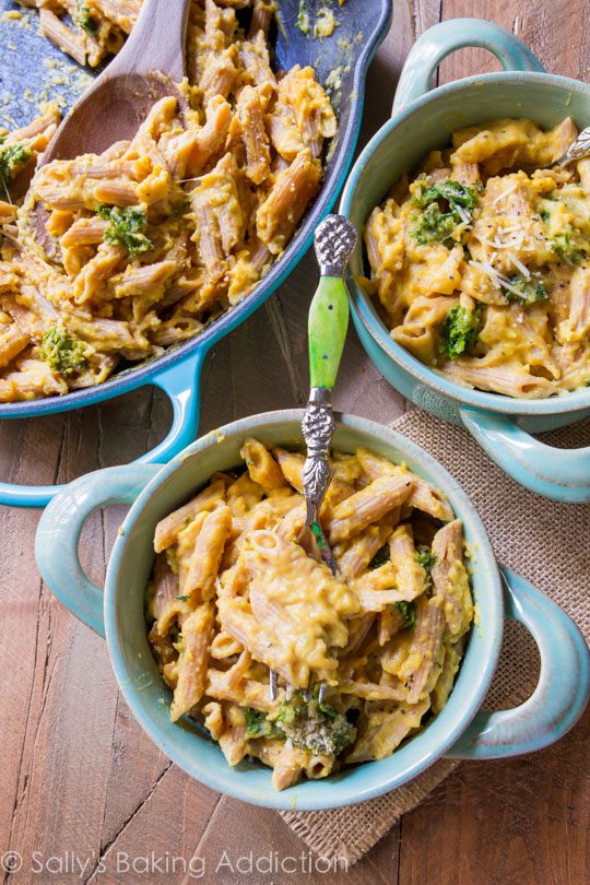 butternut squash macaroni and cheese in blue bowls with a fork