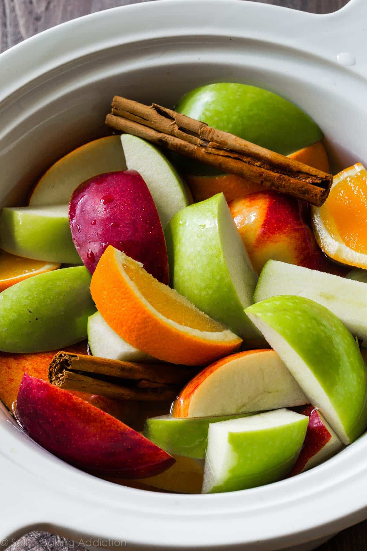 fruit and cinnamon sticks for apple cider in slow cooker