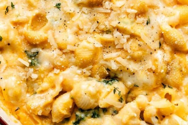 close up overhead photo of butternut squash mac and cheese with kale.
