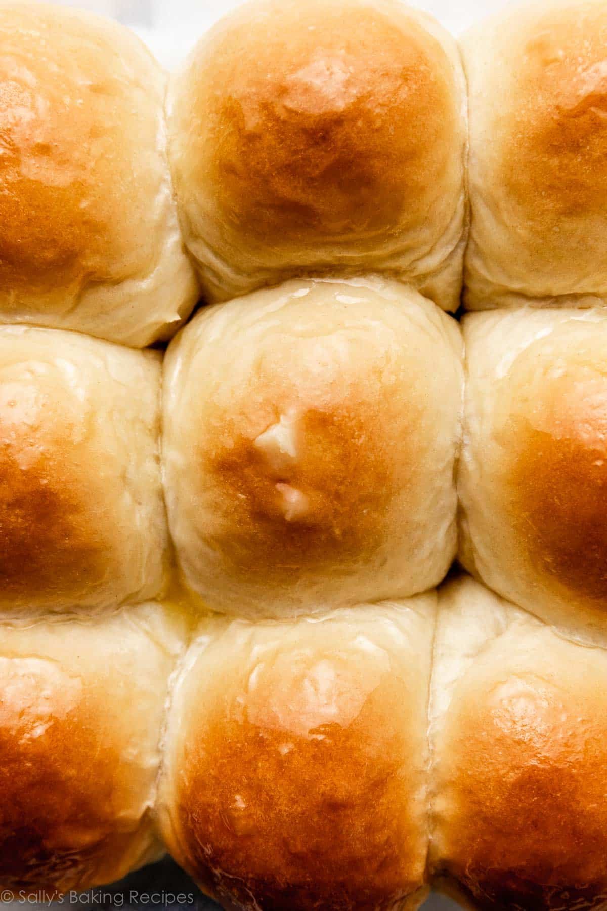 close-up photo of the top of honey butter rolls.
