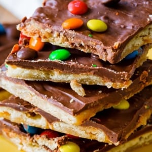 stack of pieces of Saltine toffee with mini M&Ms on top
