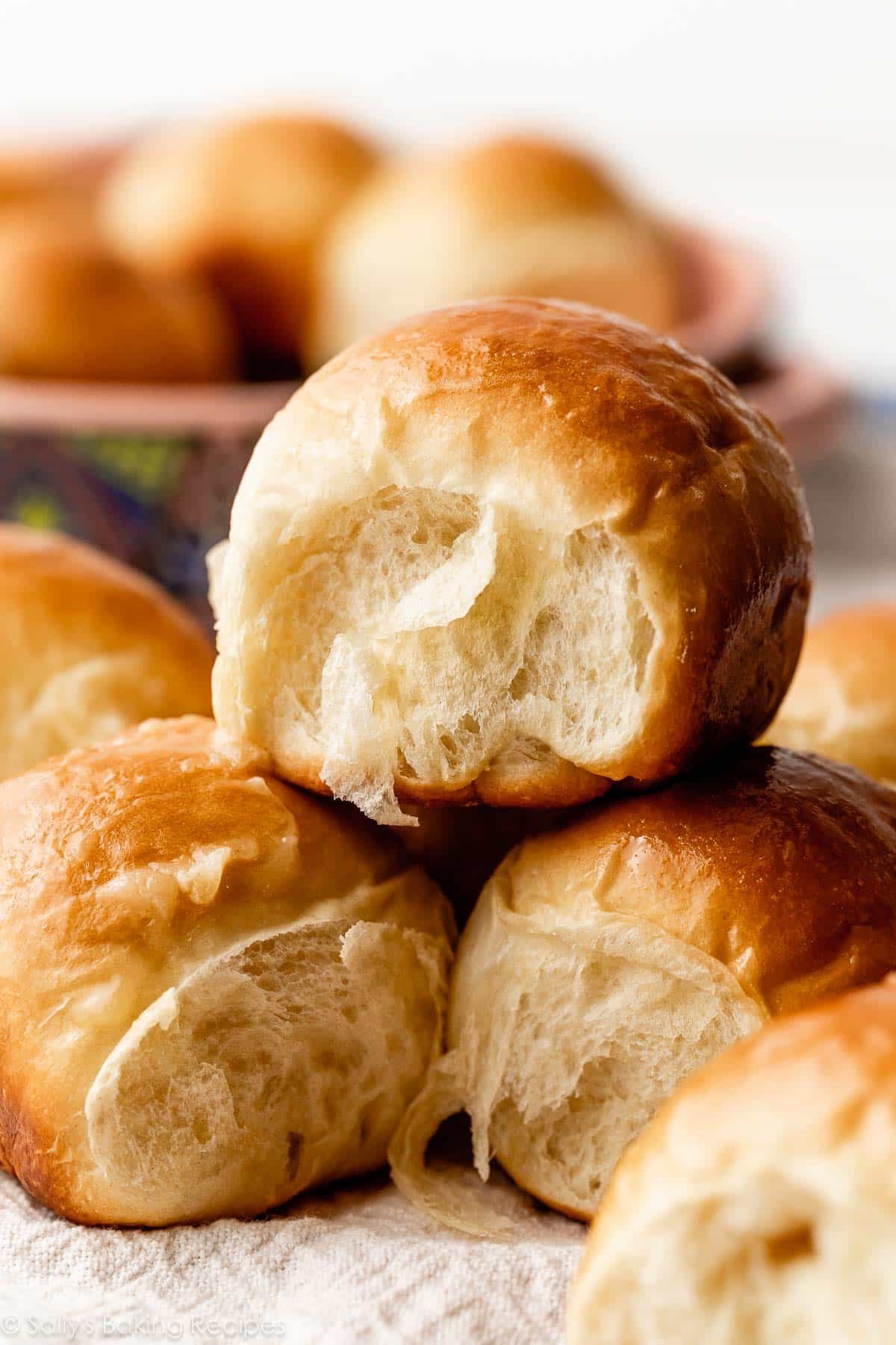 close-up photo of honey butter rolls with flaky sides.
