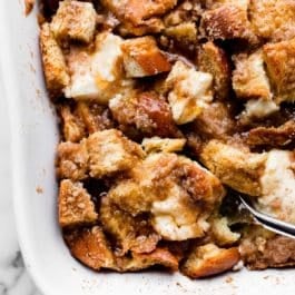 spooning a serving of baked cream cheese French toast casserole