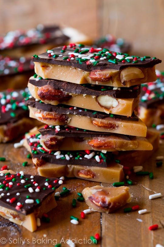 stack of salted dark chocolate almond toffee with christmas sprinkles