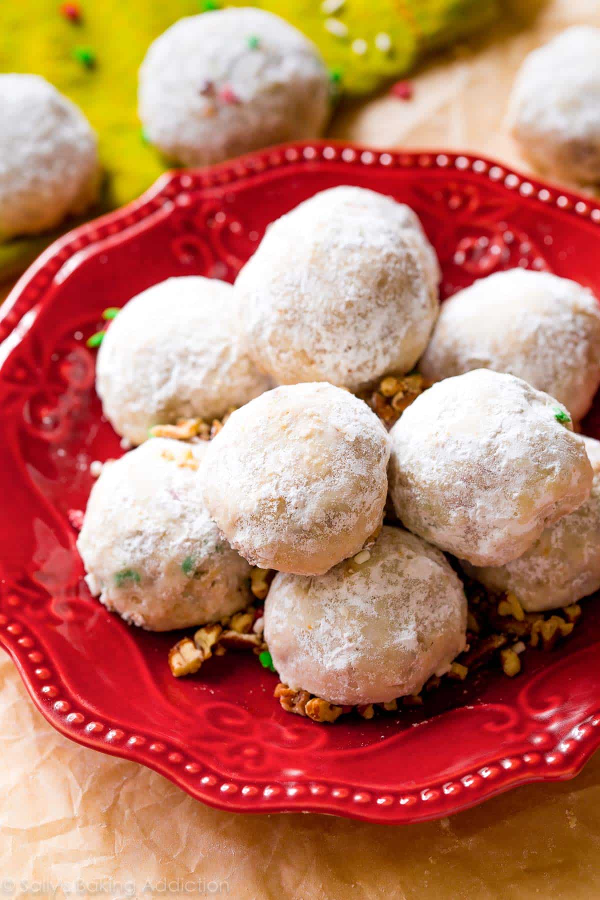 pecan snowball cookies on a red plate