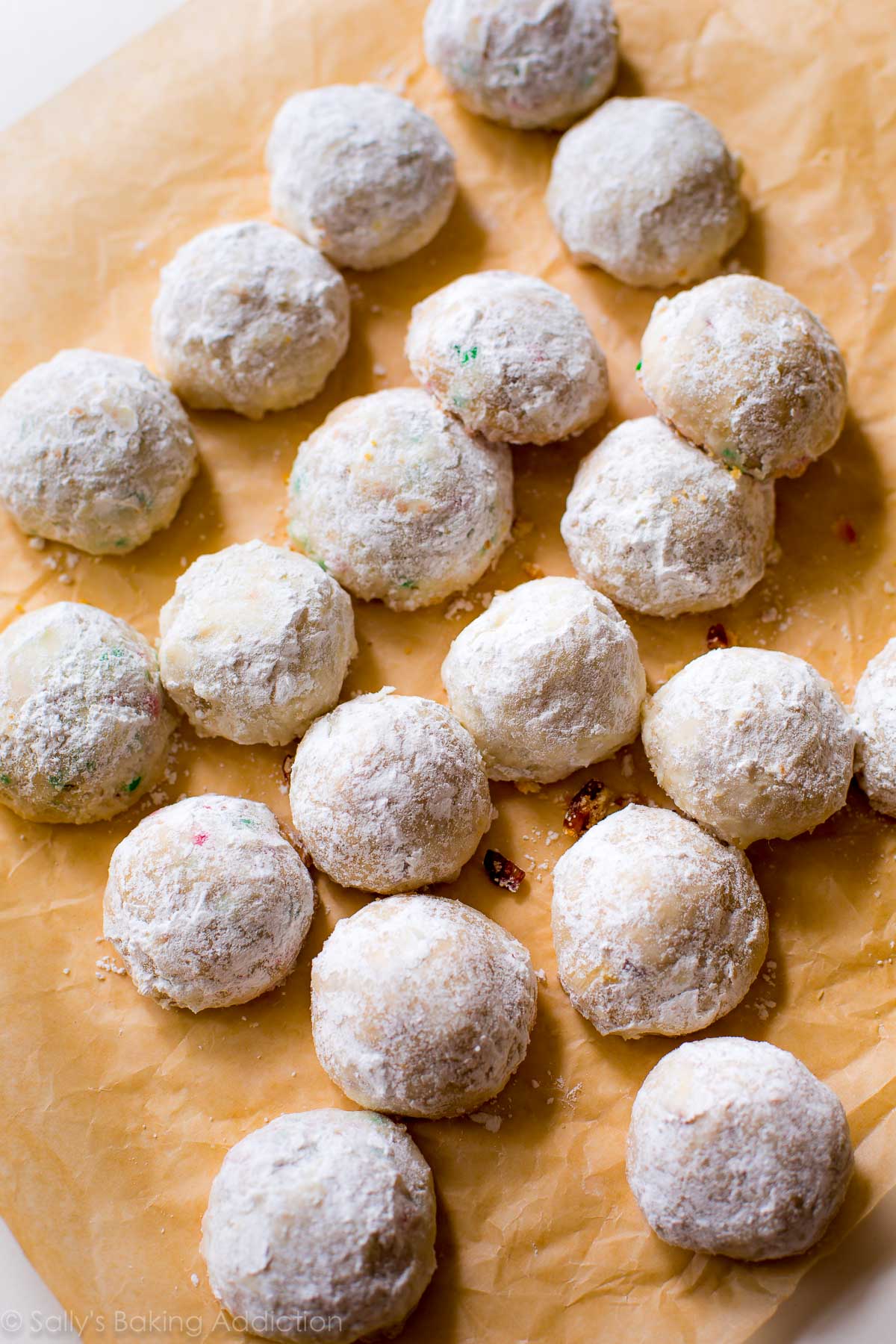 overhead image of snowball cookies on parchment paper