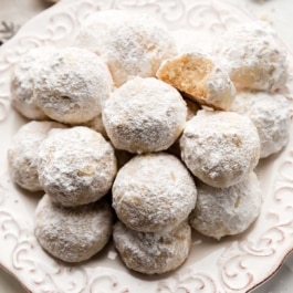 snowball cookies on white plate.