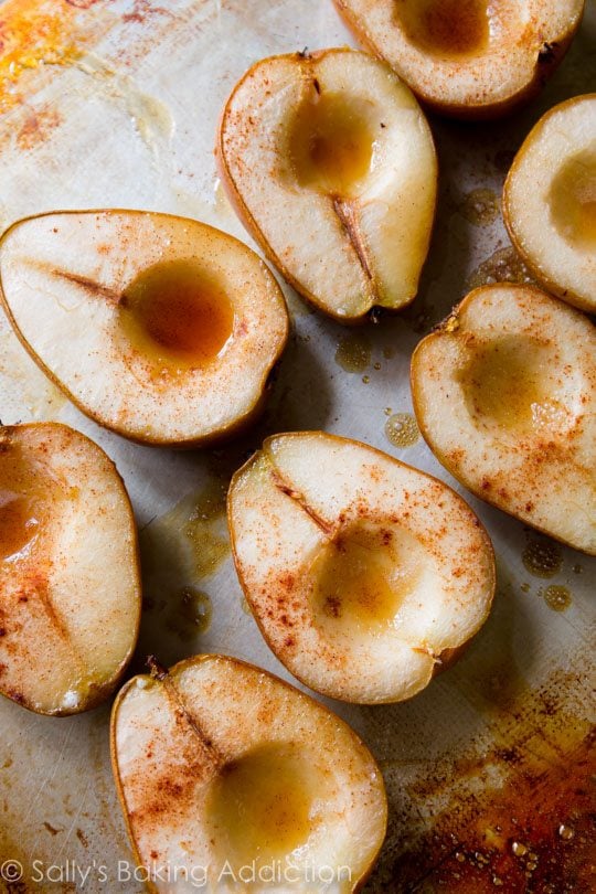 overhead image of maple baked pears on a baking sheet