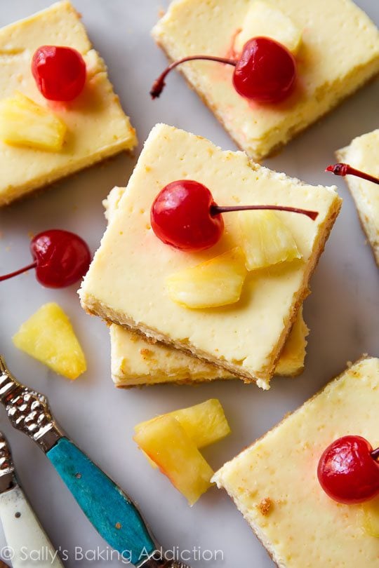 pineapple Greek yogurt bars with pineapple chunks and cherries on top