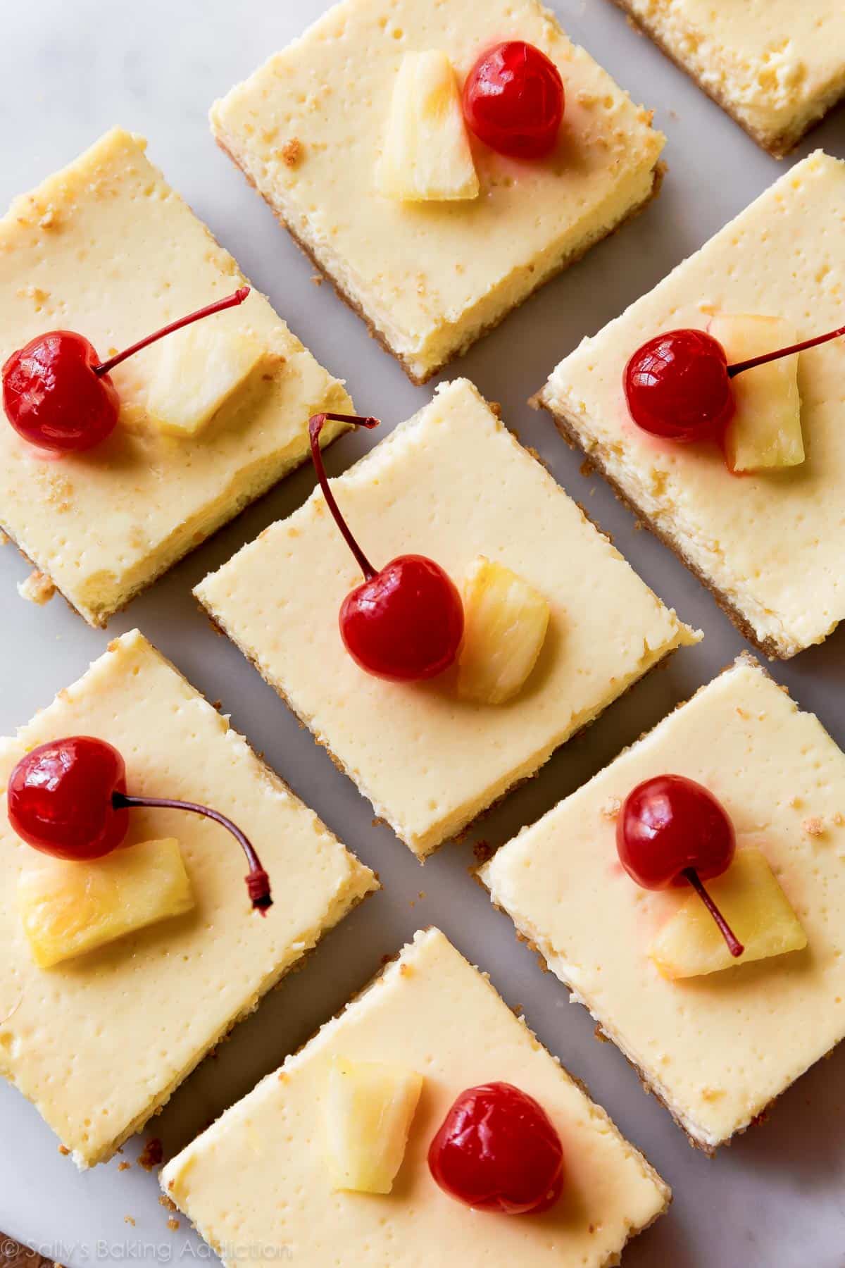 Pineapple bars topped with pineapple slices and cherries