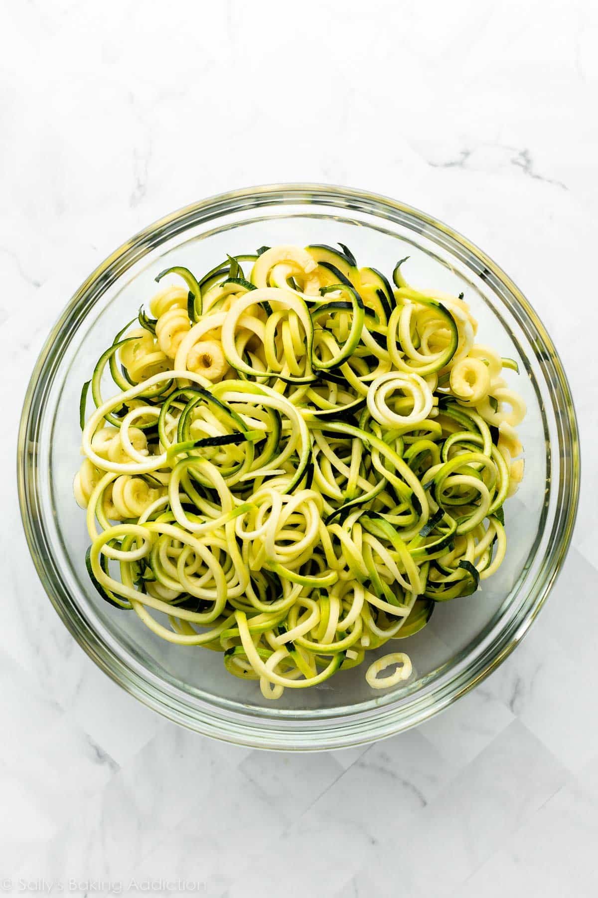 zucchini noodles in glass bowl.