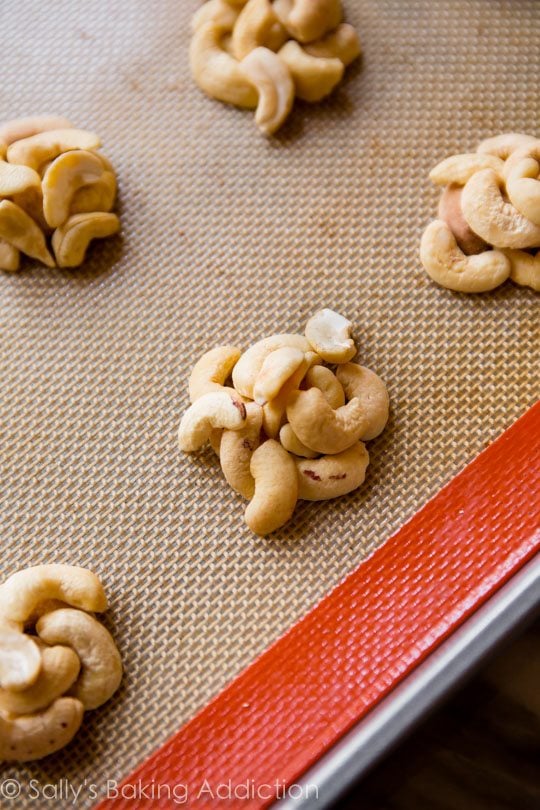 clusters of cashews on a silpat baking mat
