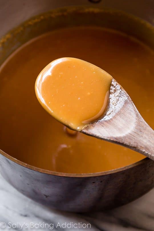 caramel in a saucepan with a wood spoon