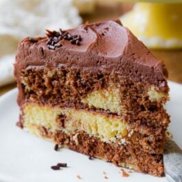 slice of marble layer cake on a white plate