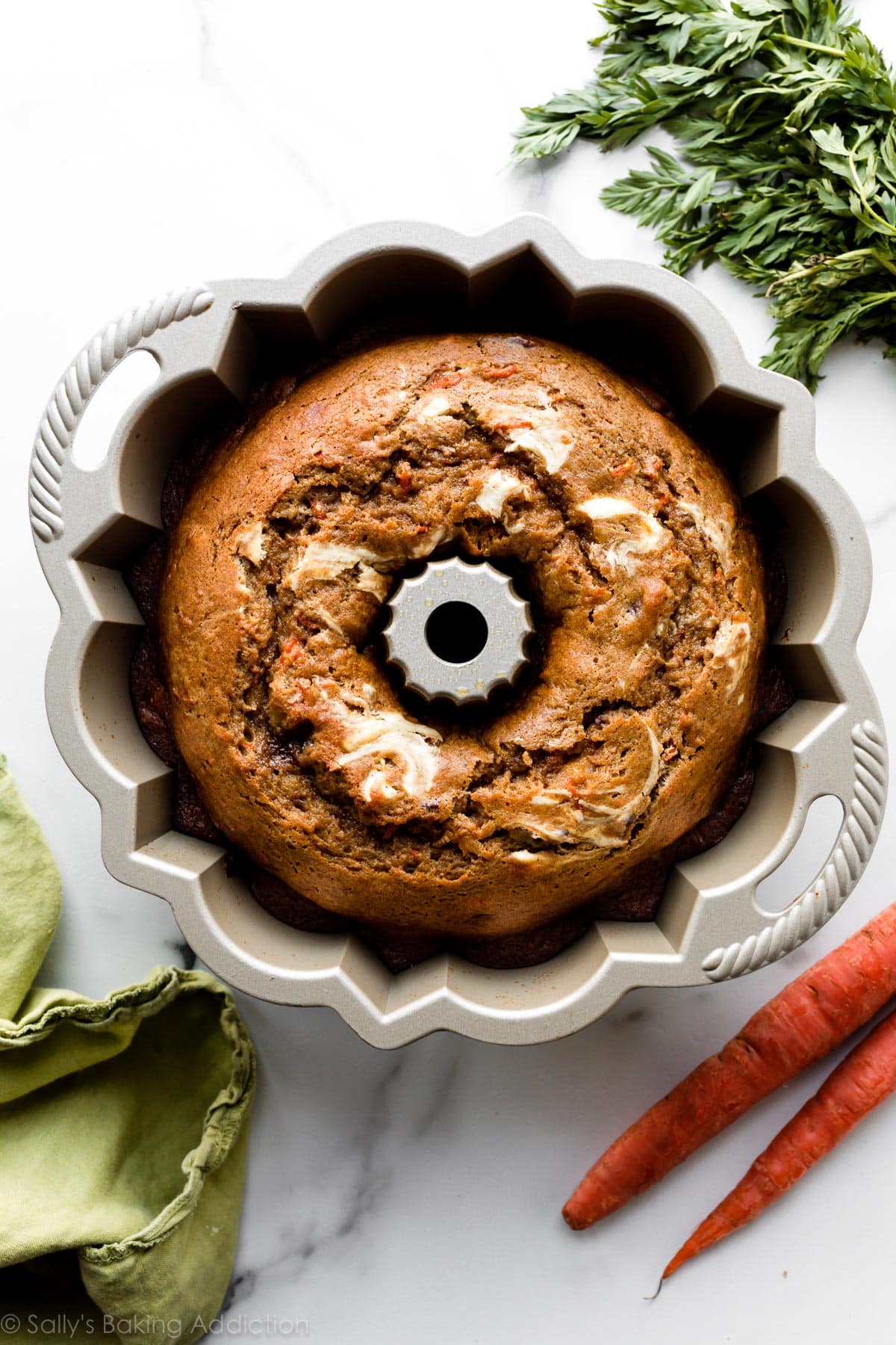 Carrot cake Bundt cake with cream cheese swirl in a Nordic Ware Bundt skillet