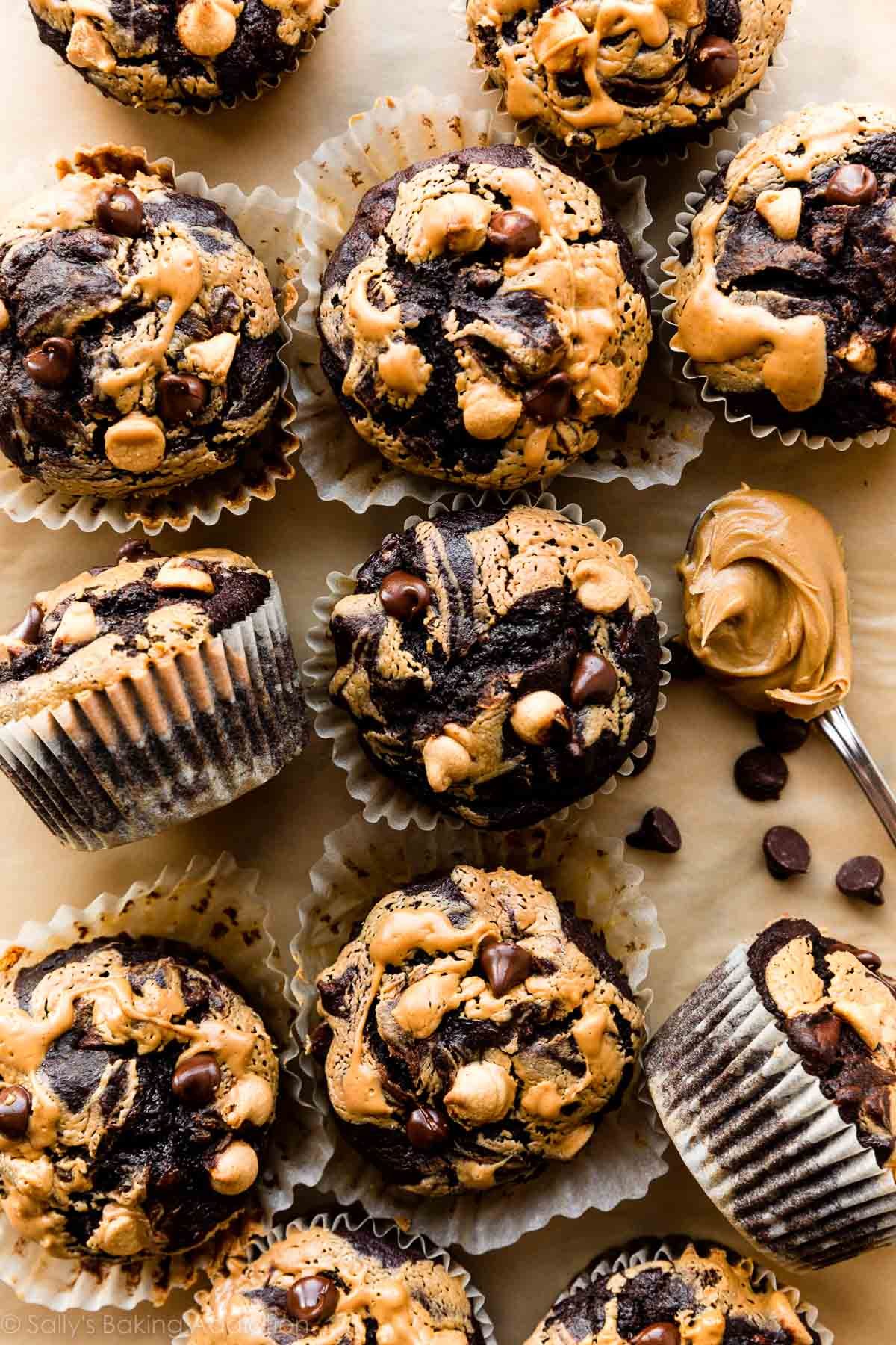 double chocolate banana muffins with peanut butter swirl and peanut butter chips on top.