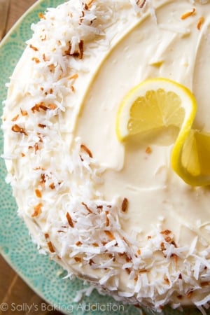overhead image of lemon coconut cake on a teal plate