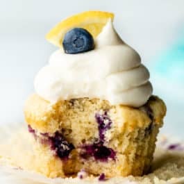 lemon blueberry cupcake with bite taken out of it.