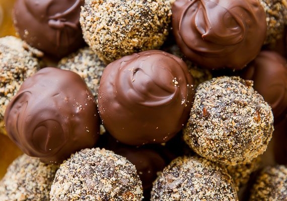 dark chocolate coconut rum balls on a gold plate