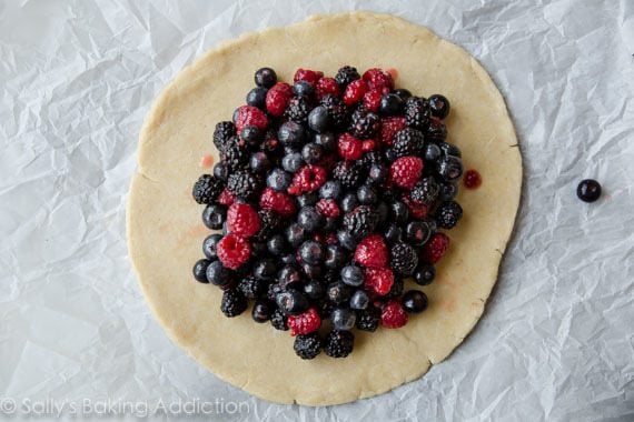 cornmeal crust rolled into a circle topped with mixed berry filling