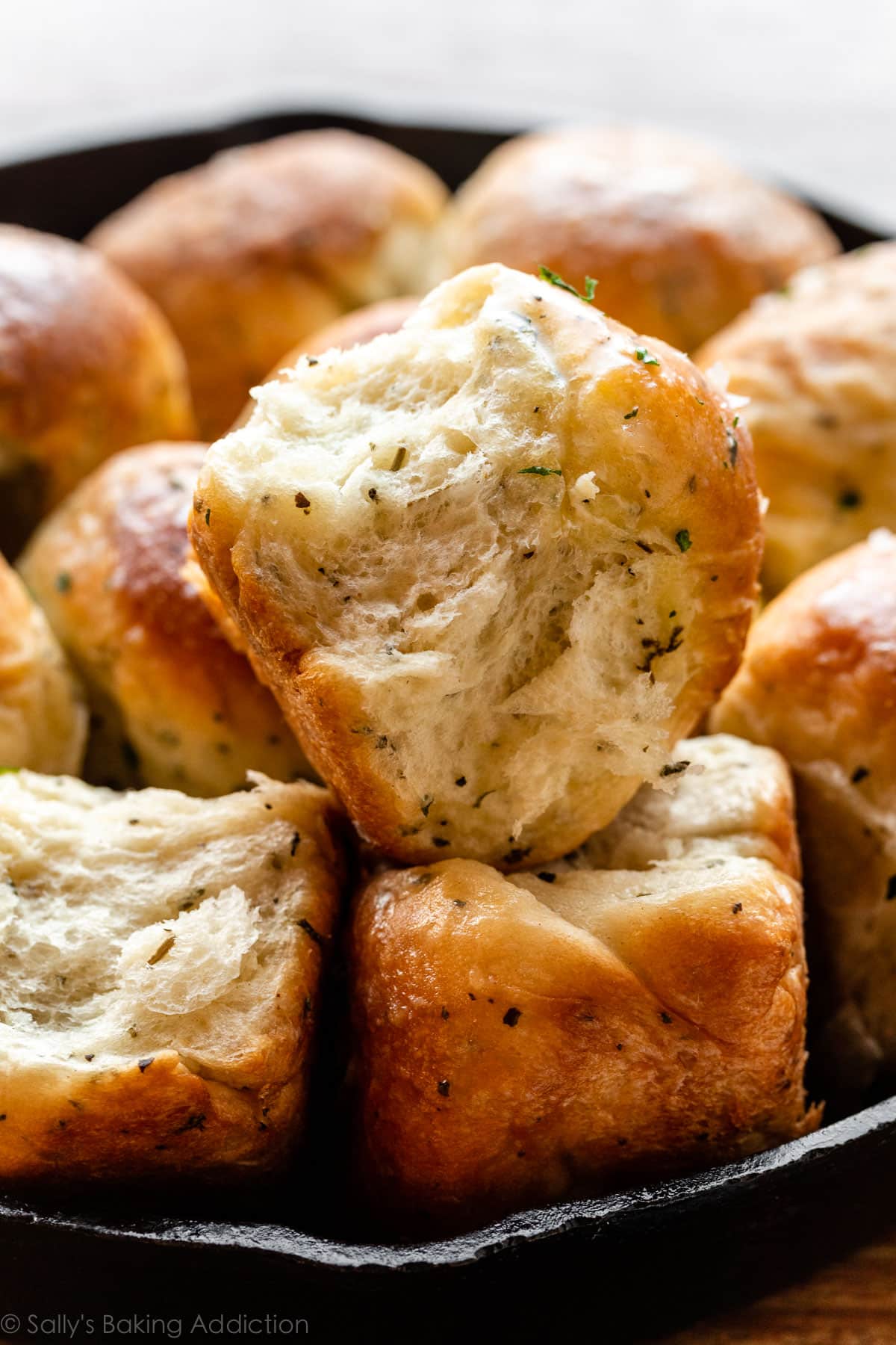 flaky dinner roll with rosemary, parsley, basil, and garlic