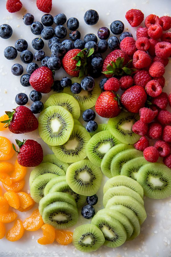 fresh fruit on a white cutting board