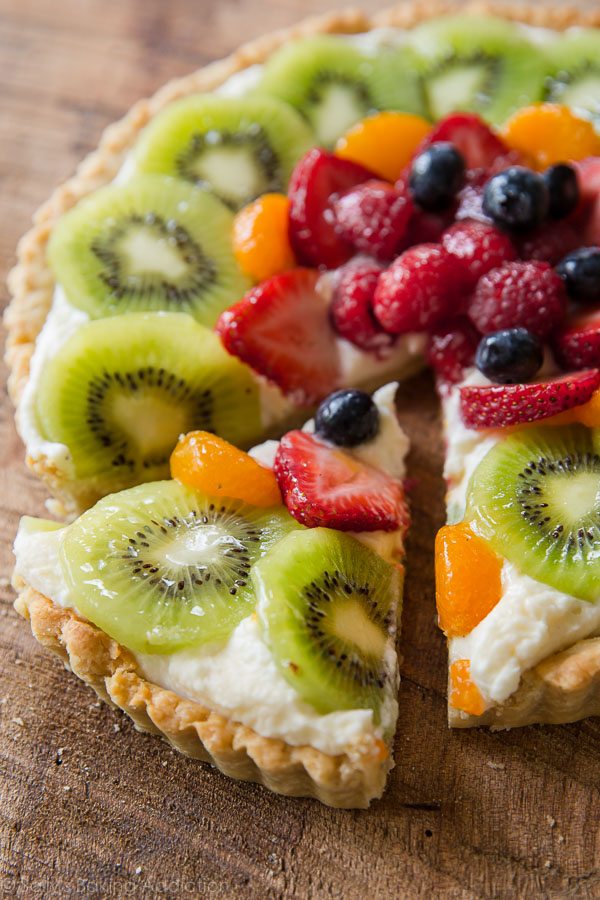 fresh fruit tart with a slice cut out