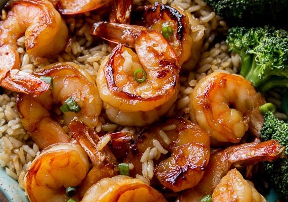 Honey garlic shrimp in a bowl with rice and broccoli